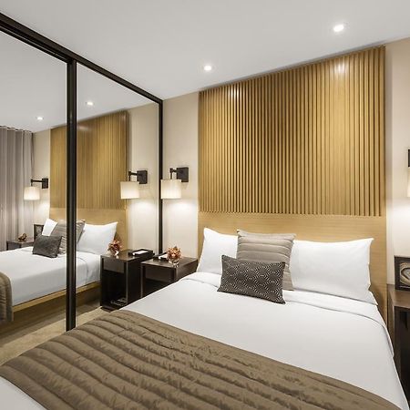 Skye Hotel Suites Parramatta Exterior foto A bedroom at the hotel